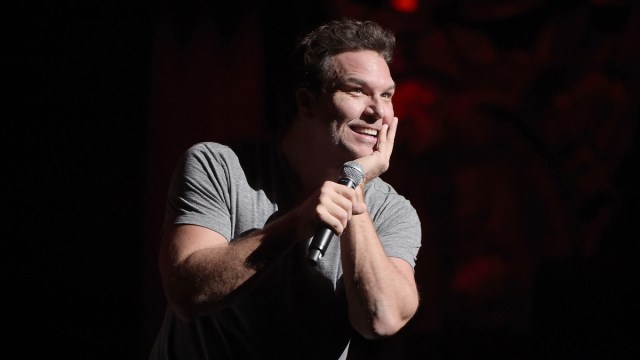 Dane Cook holding microphone