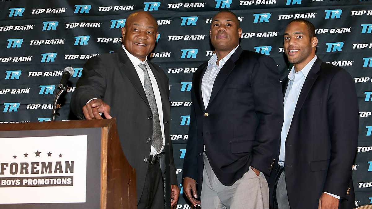 George Foreman is posing with his sons.