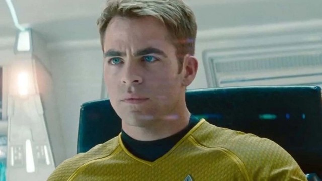 James T. Kirk (Chris Pine) sits in the captain's chair of the USS Enterprise in 2009's Star Trek.