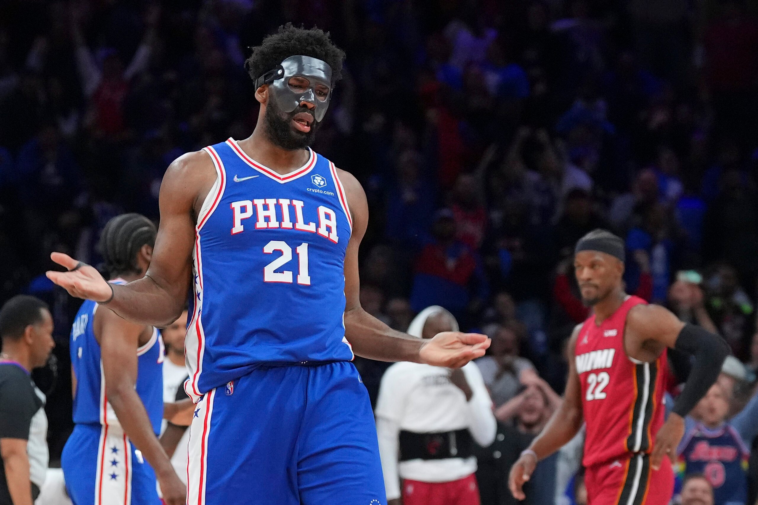 Joel Embiid wearing a protective face mask during an NBA game.