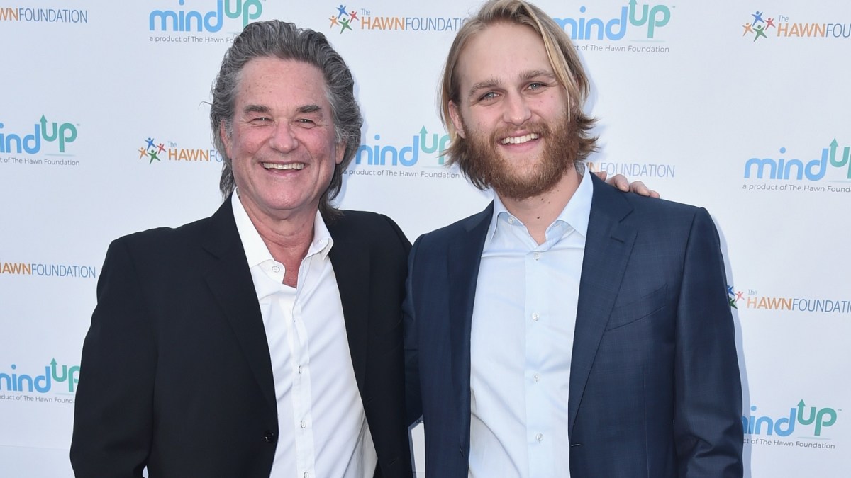 Kurt and Wyatt Russell standing together