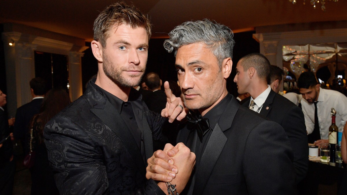 Chris Hemsworth (L) and director Taika Waititi