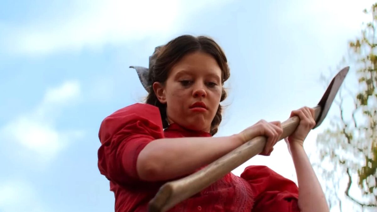 Mia Goth in Pearl wielding an ax