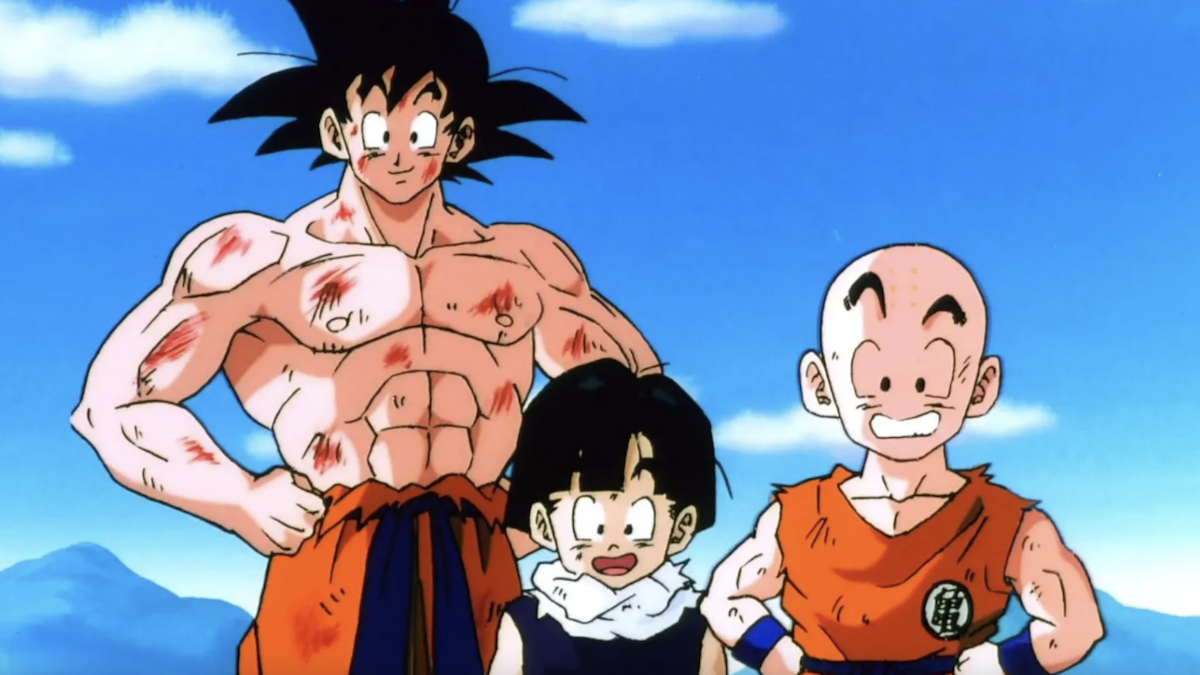 Goku is standing shirtless next to two other Dragon Ball characters.