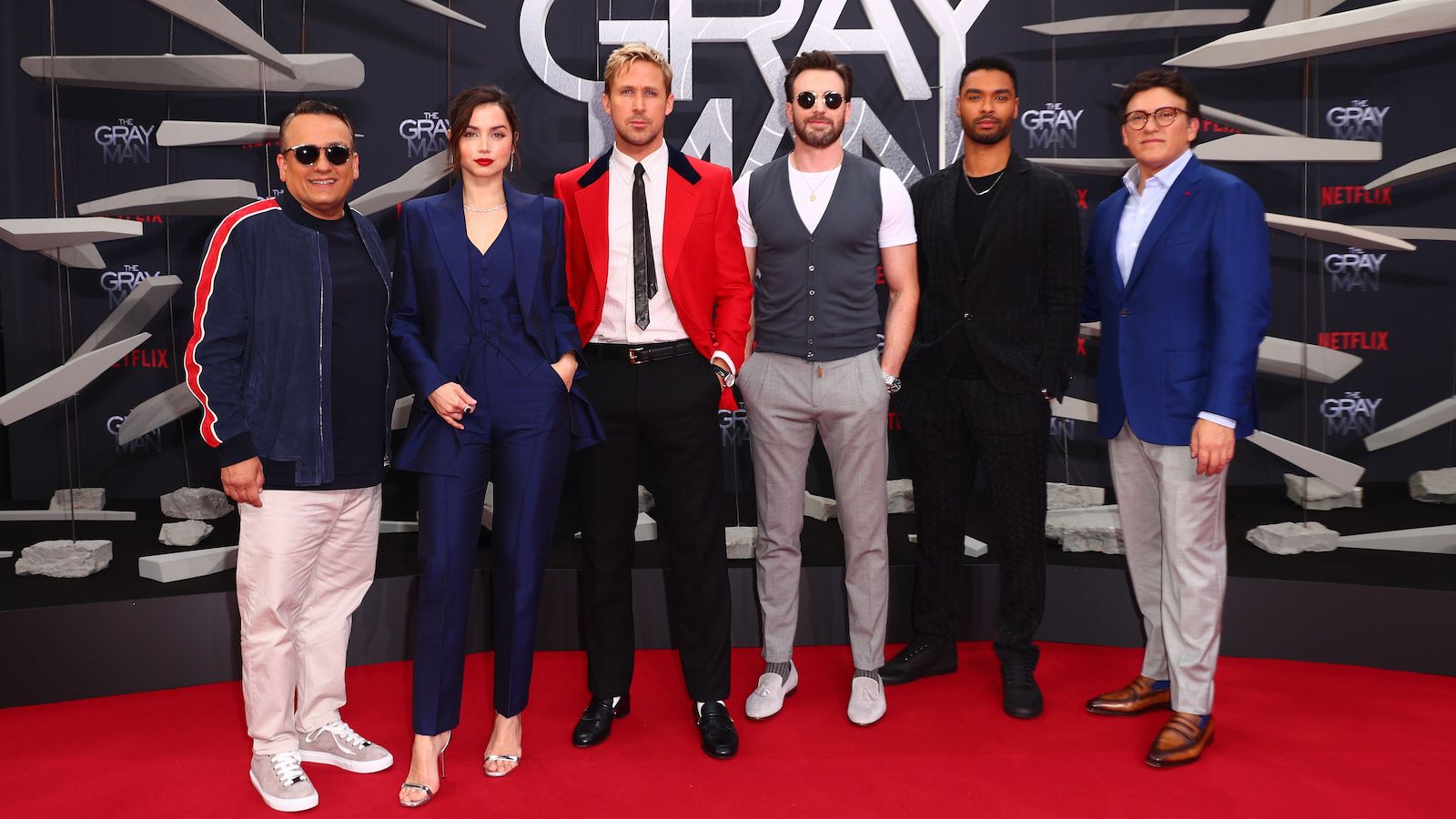 The Russo Brothers pose with the cast of 'The Gray Man' on the red carpet