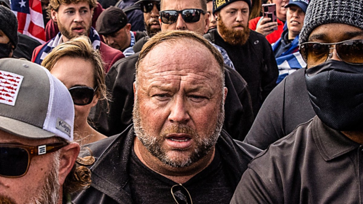 Alex Jones in a crowd on January 6, 2021, looking dazed