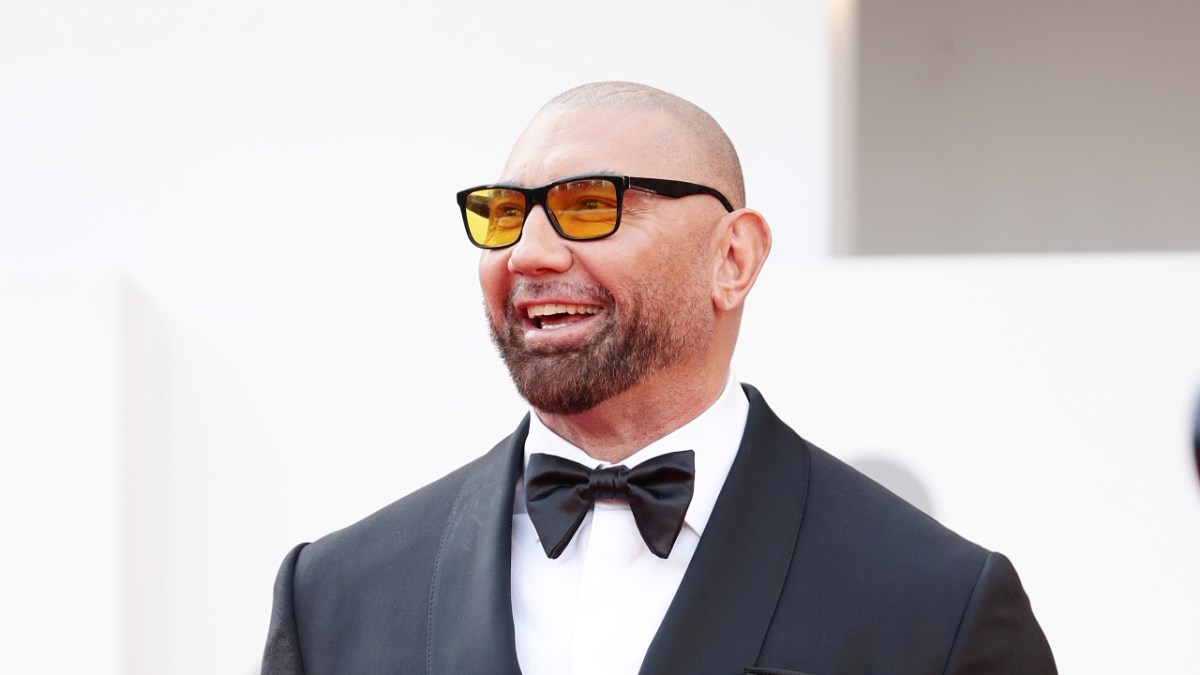 Dave Bautista shoulders up in sunglasses and a tuxedo