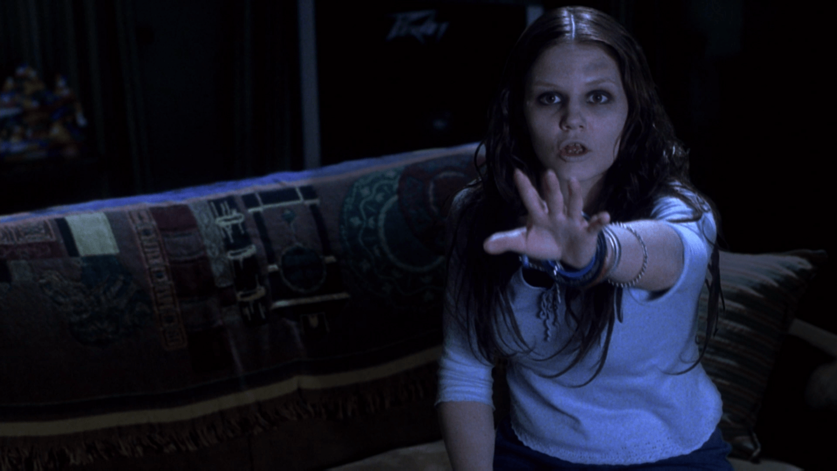 A still of a ghostly woman, her hand outstretched, from “Stir of Echoes” (1999)