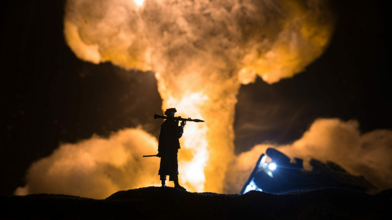 Military soldier silhouette with bazooka. War Concept. Military silhouettes fighting scene on war fog sky background, Soldier Silhouette aiming to the target at night. Attack scene