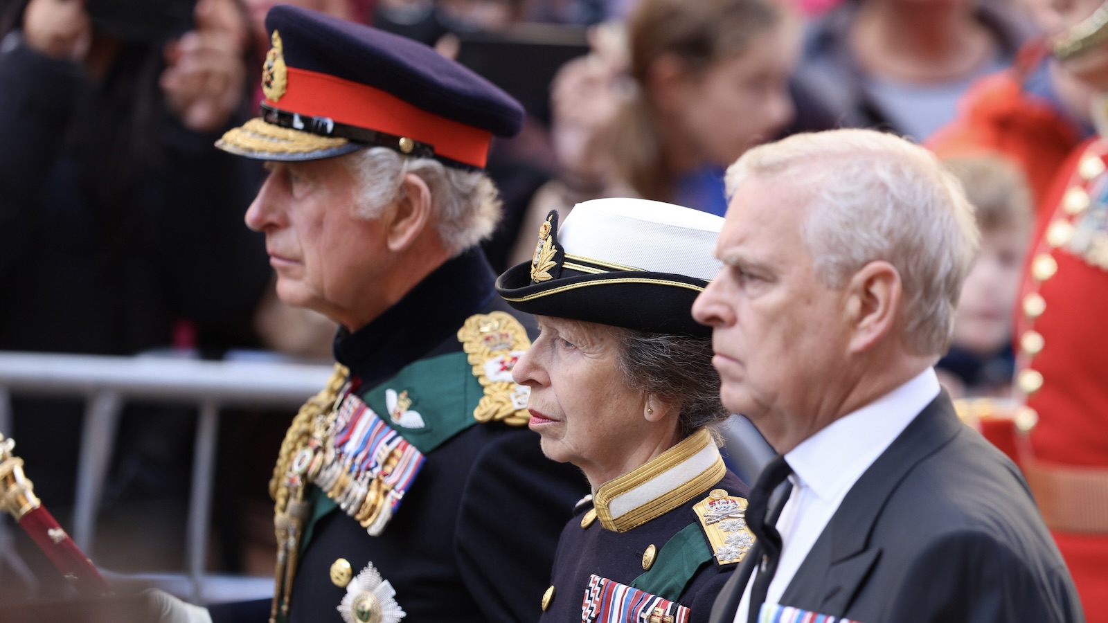 King Charles III, Princess Anne, Princess Royal and Prince Andrew, Duke of York walk behind Queen Elizabeth II's Coffin as it heads to St Giles Cathedral