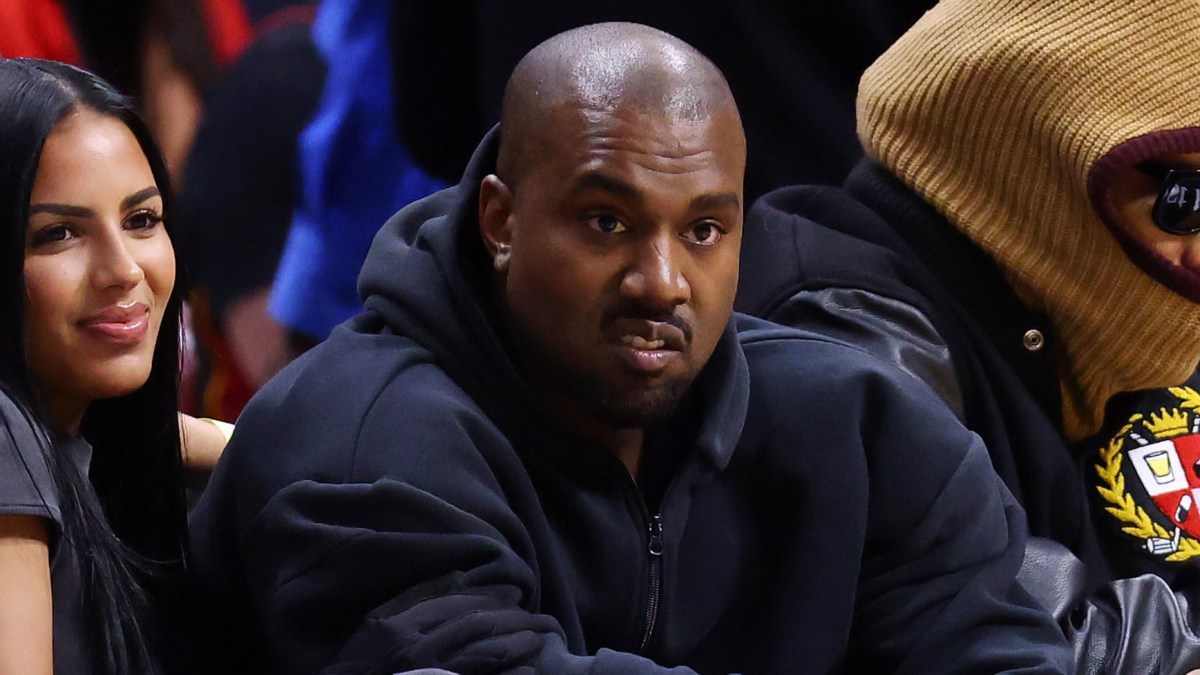 Rapper Kanye West and girlfriend Chaney Jones attend a game between the Miami Heat and the Minnesota Timberwolves at FTX Arena on March 12, 2022 in Miami, Florida. NOTE TO USER: User expressly acknowledges and agrees that, by downloading and or using this photograph, User is consenting to the terms and conditions of the Getty Images License Agreement. (Photo by Michael Reaves/Getty Images)