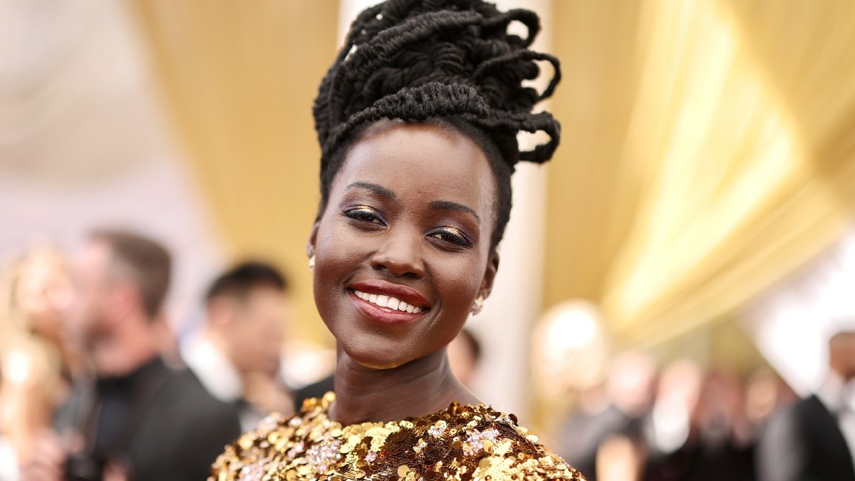 Lupita Nyong'o strikes a pose at a red carpet event.