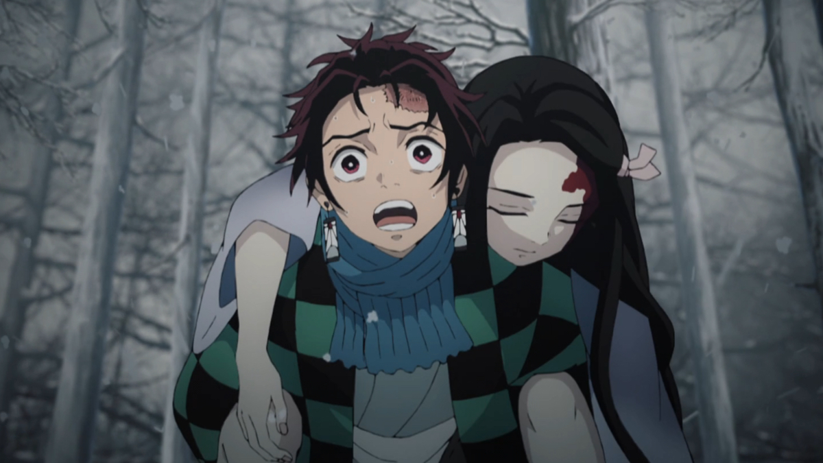 Tanjiro carries an unconscious Nezuko.
