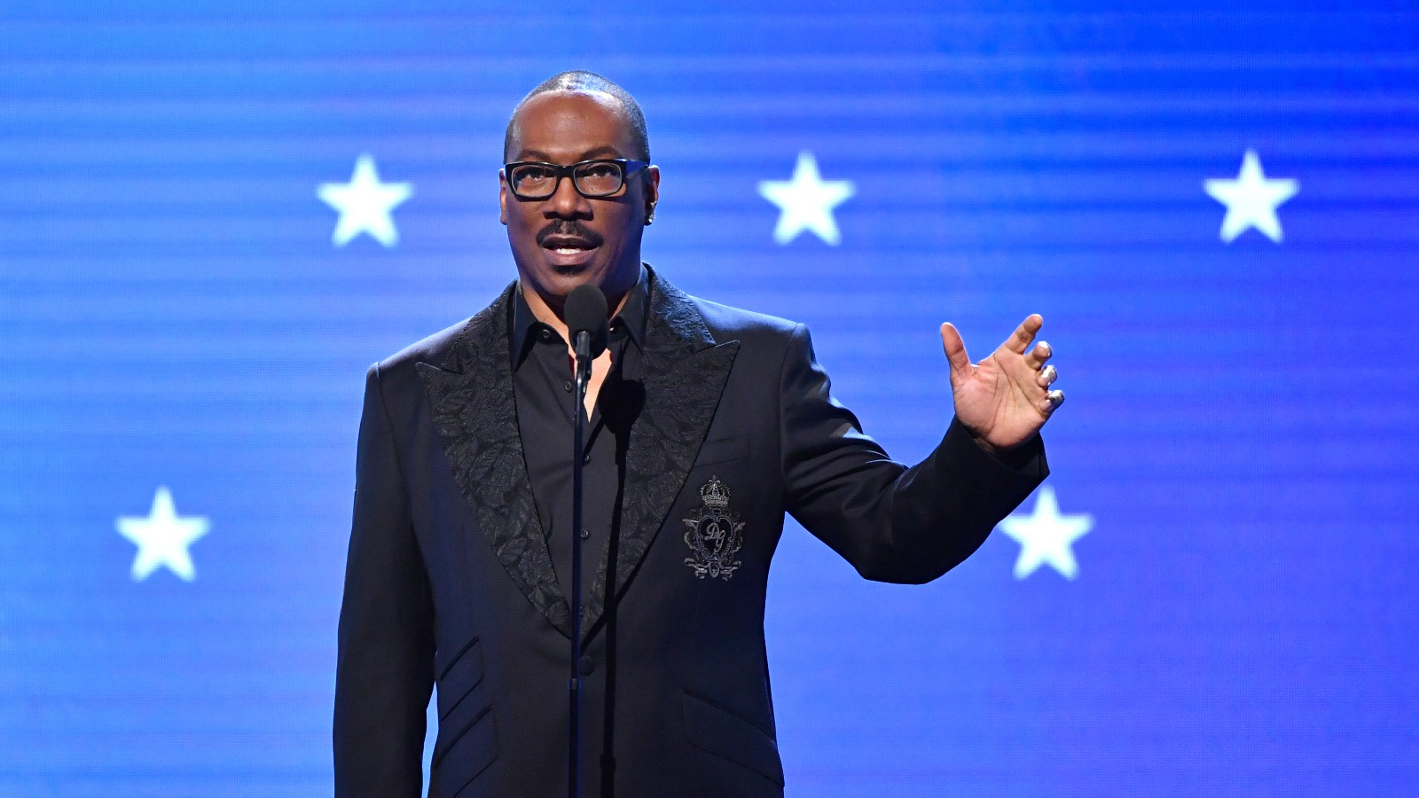 Eddie Murphy gives a speech at an award show.