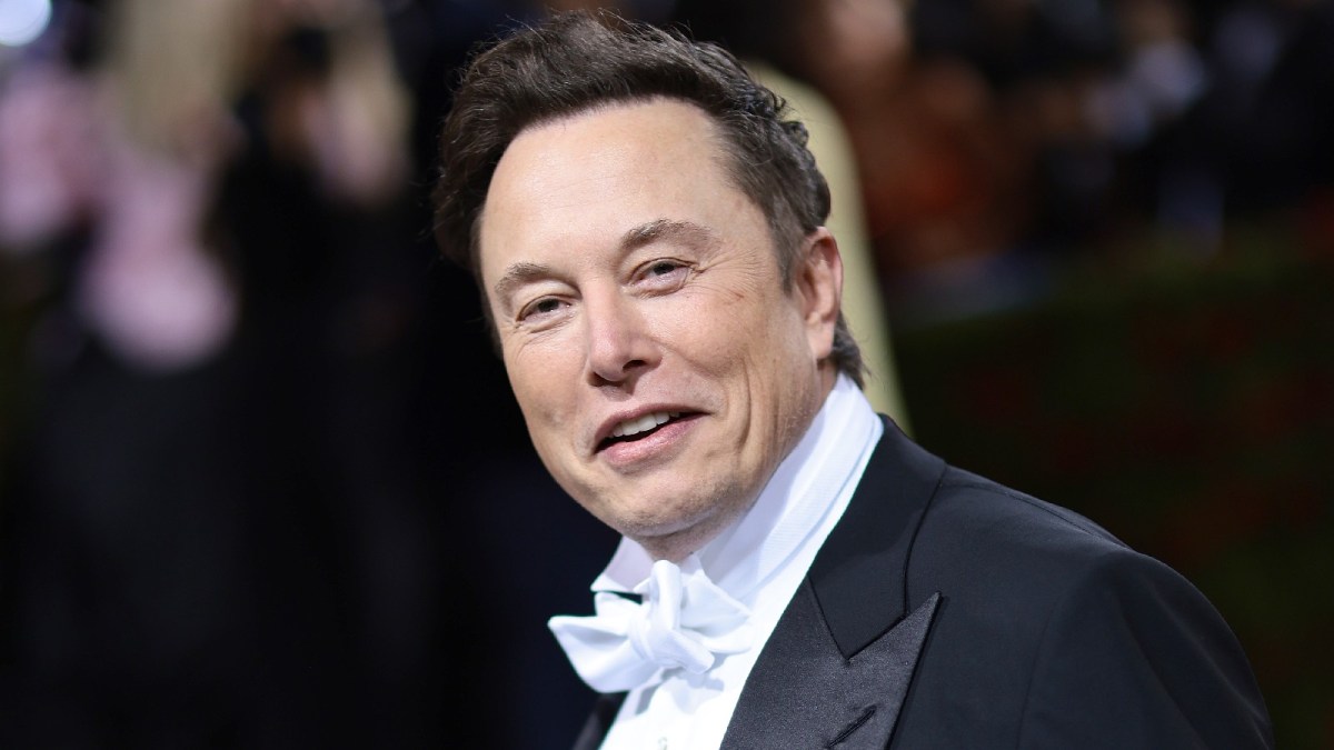 Elon Musk sports a tuxedo at a red carpet event.