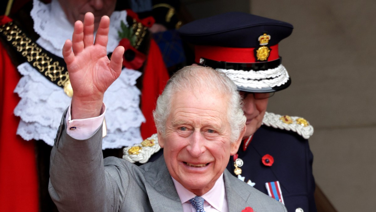 King Charles III waves as he departs a reception at Bradford City Hall during an official visit to Yorkshire on November 08, 2022 in Bradford, England.