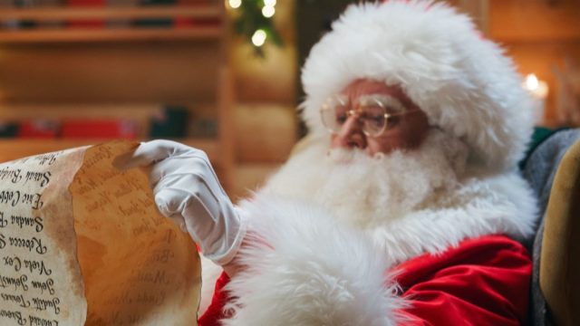 anta Claus is sitting in an armchair, holding an ancient paper scroll in his hands and carefully reading the names on the list, checking if he has forgotten about someone