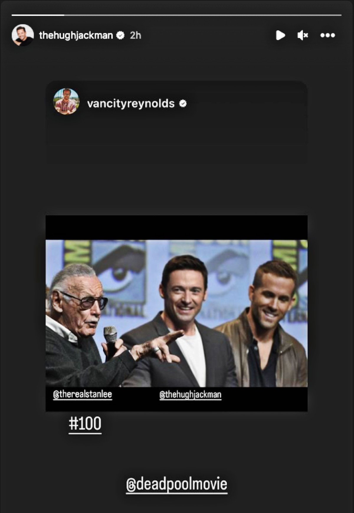 An image of Stan Lee, Hugh Jackman, and Ryan Reynolds sitting together on stage at Comic Con