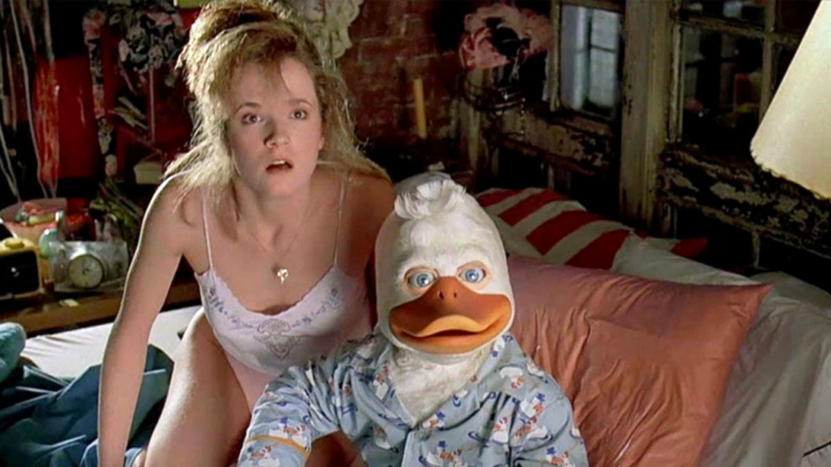 Lea Thompson's Beverly is caught in bed with Howard the Duck in a still from the 1986 film of the same name.