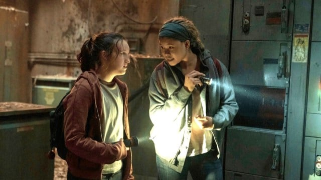 Riley (Storm Reid) and Ellie (Bella Ramsey) navigating a dark room by torchlight