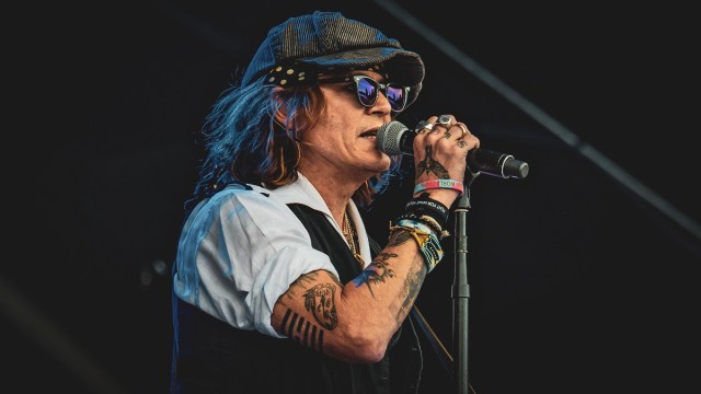 HELSINKI, FINLAND - JUNE 19: Johnny Depp performs on stage with Jeff Beck during the Helsinki Blues Festival at Kaisaniemen Puisto on June 19, 2022 in Helsinki, Finland.
