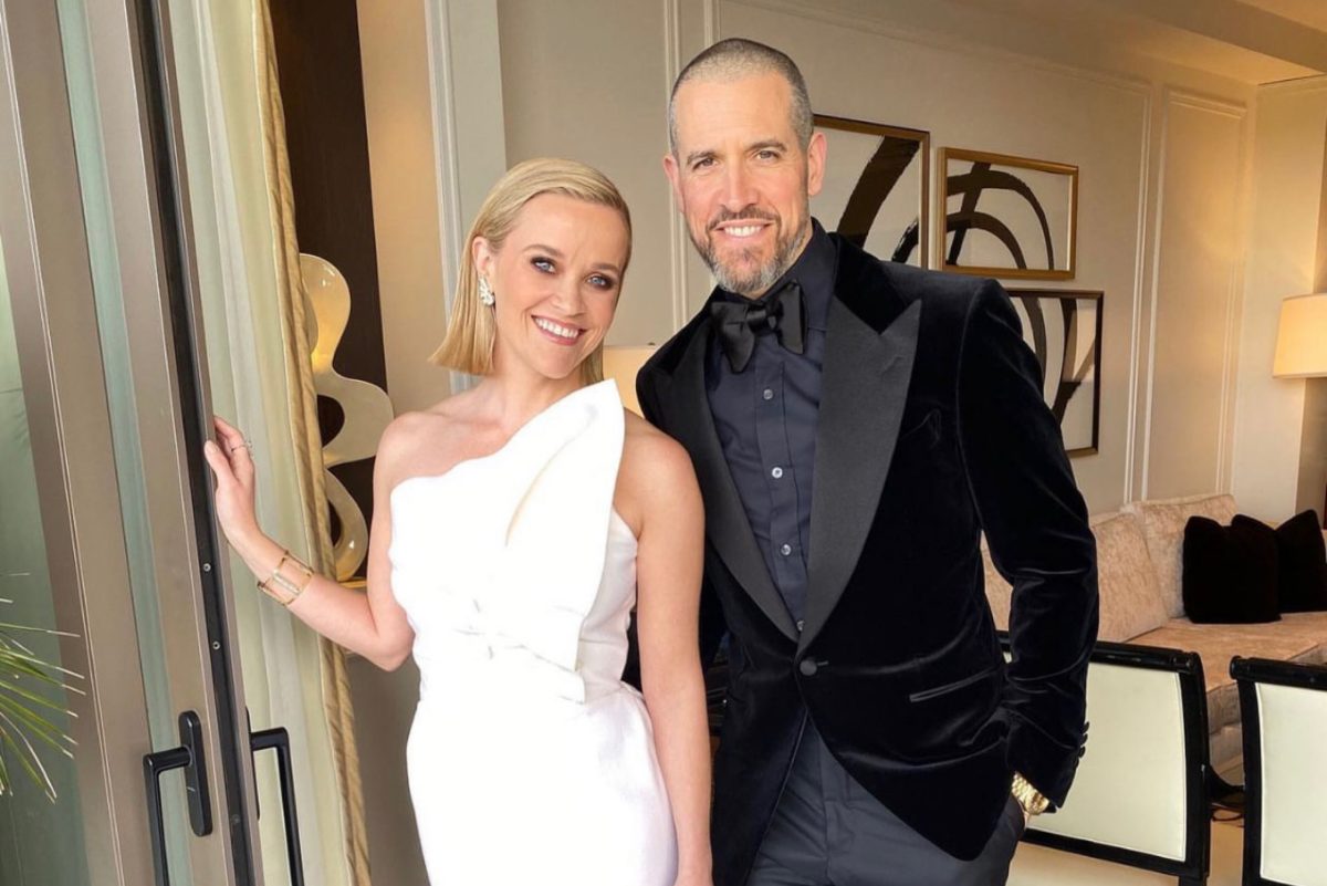 Reese Witherspoon in a white dress beside her ex-husband Tim Toth, who is wearing a black suit