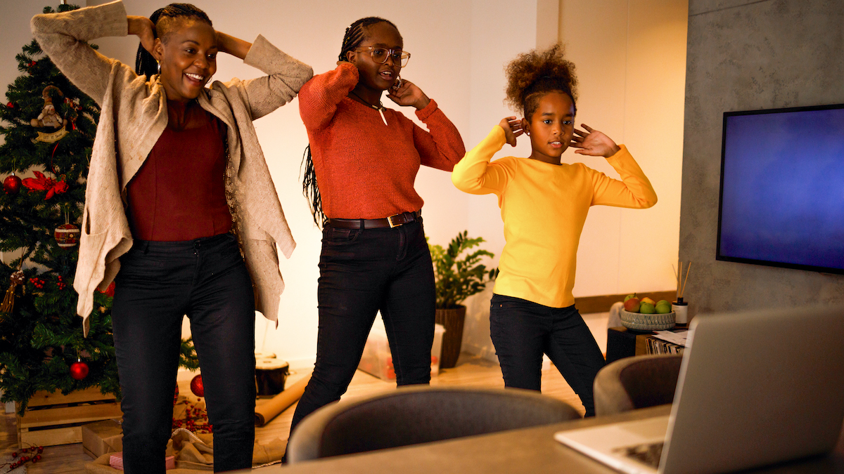 Getty: "Three female members of an African American family have lots of fun dancing Tik Tok routines on Christmas day."