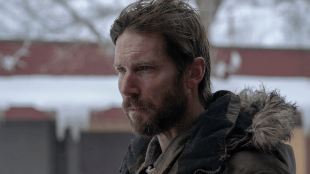James (Troy Baker) standing outdoors in 'The Last of Us'