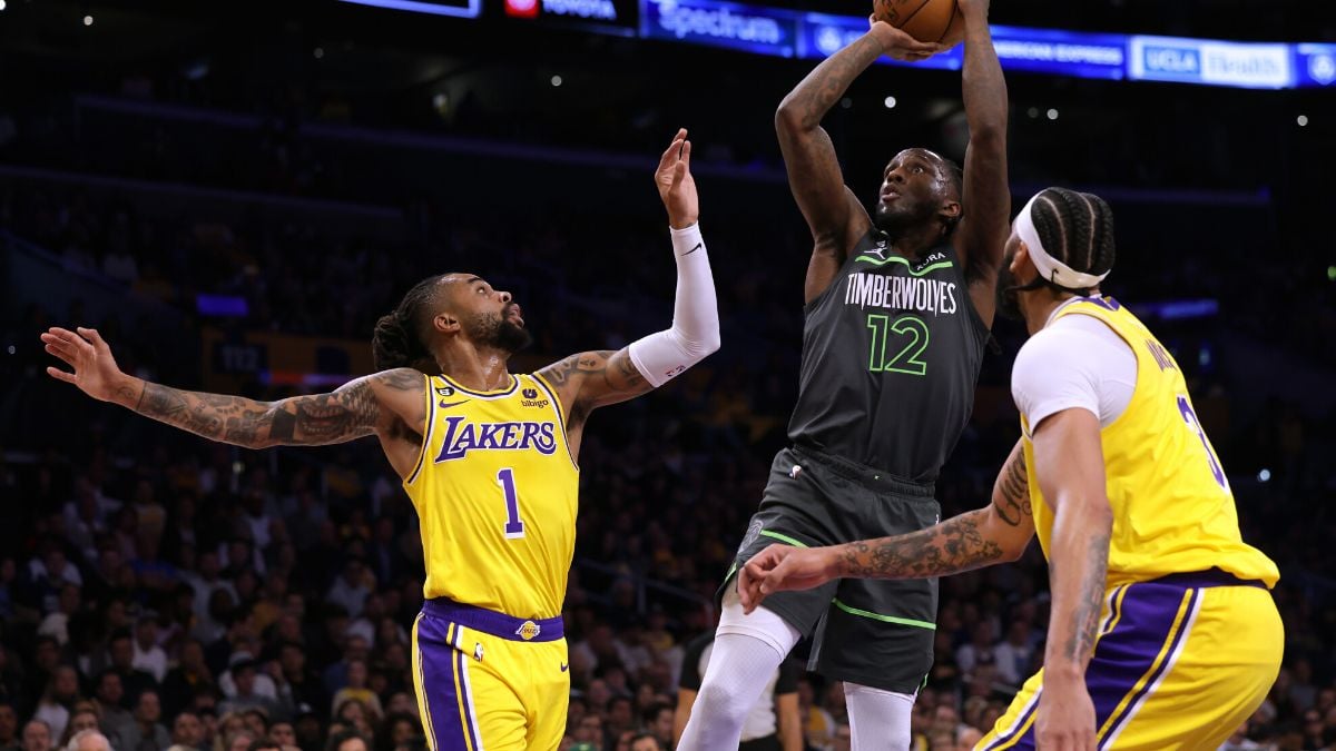 LOS ANGELES, CALIFORNIA - APRIL 11: Taurean Prince #12 of the Minnesota Timberwolves attempts a shot betweem D'Angelo Russell #1 and Anthony Davis #3 of the Los Angeles Lakers during the first half in a play-in tournament game at Crypto.com Arena on April 11, 2023 in Los Angeles, California.