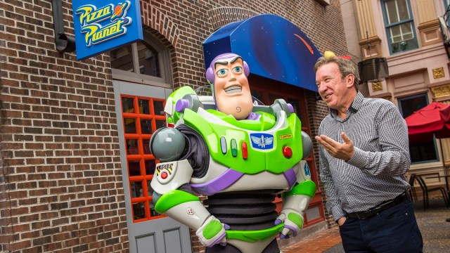 LAKE BUENA VISTA, FL - DECEMBER 31: In this handout photo provided by Disney Parks, actor and comedian Tim Allen, the voice of Buzz Lightyear in the Disney-Pixar "Toy Story" series of animated films, poses with Buzz Lightyear December 31, 2014 at Disney's Hollywood Studios theme park in Lake Buena Vista, Florida. Allen, who also starred on the hit TV series "Home Improvement" and in live-action motion pictures like "The Santa Clause," is visiting the Walt Disney World Resort to ring in the new year.