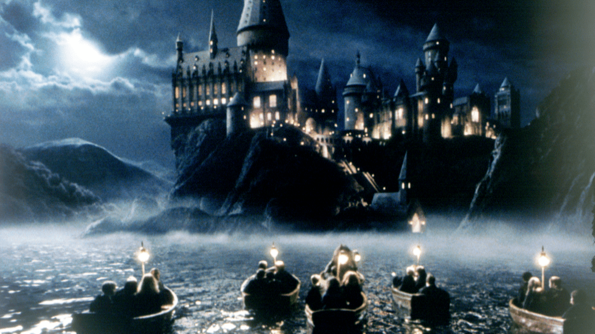 The children in their rowing boats approach Hogwarts School of Witchcraft and Wizardry