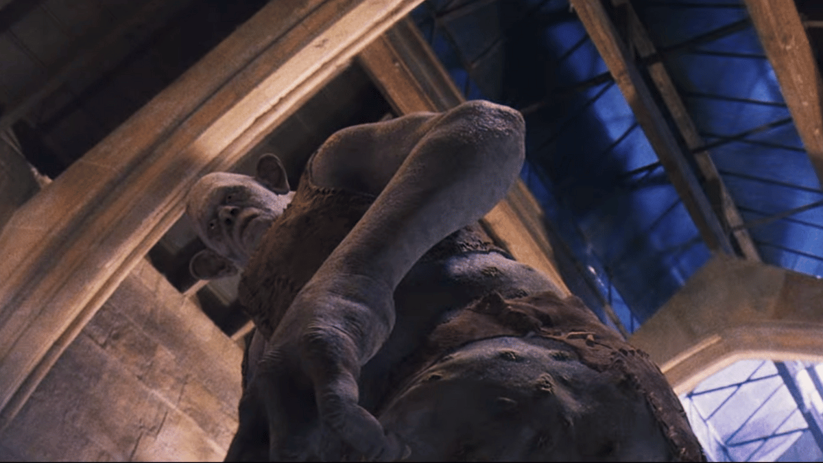 A troll looks down at the floor in 'Harry Potter and the Sorcerer's Stone'