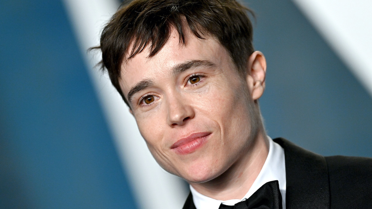 Elliot Page, dressed in a black suit, white shirt, and black bow tie, attends the 2022 Vanity Fair Oscar Party