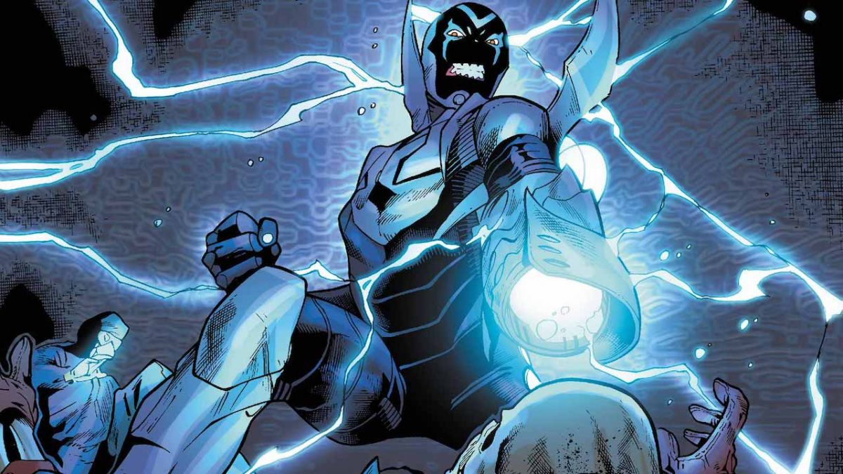 Blue Beetle firing his arm blaster