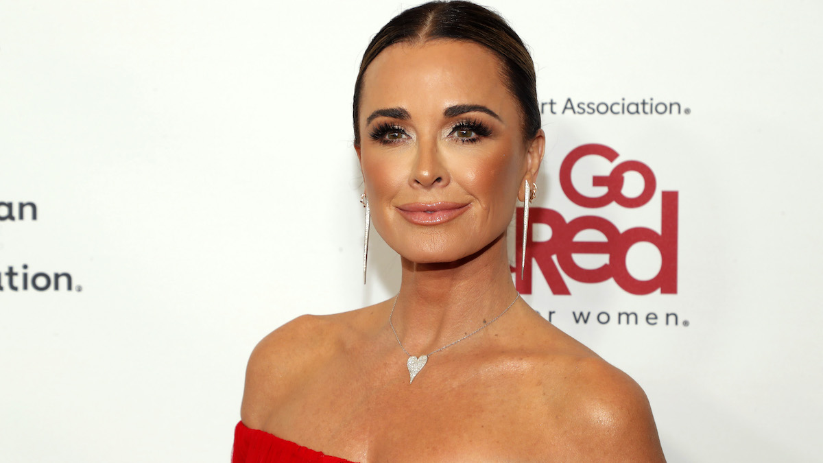 Kyle Richards wearing a strapless red dress attending The American Heart Association's Go Red for Women Red Dress Collection Concert 2023