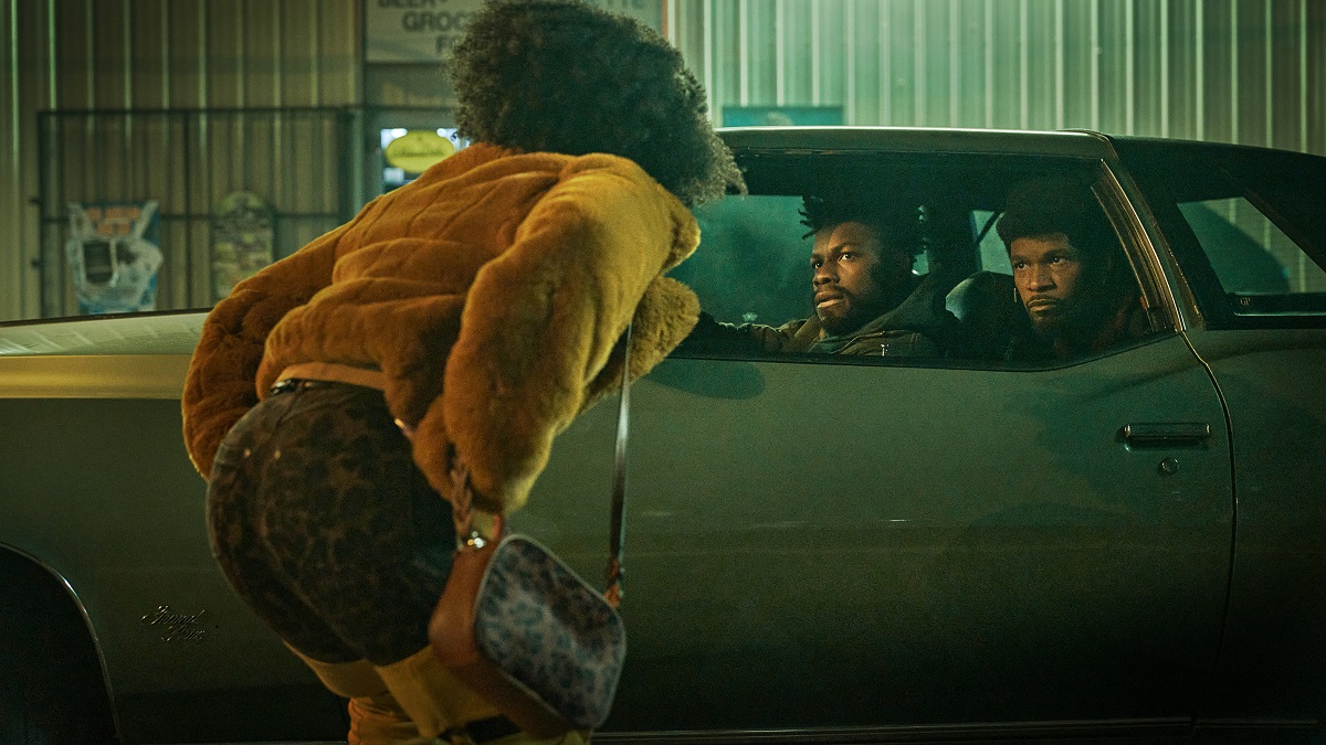 They Cloned Tyrone - (L to R) Teyonah Parris as Yo-Yo, John Boyega as Fontaine and Jamie Foxx (Producer) as Slick Charles in They Cloned Tyrone.