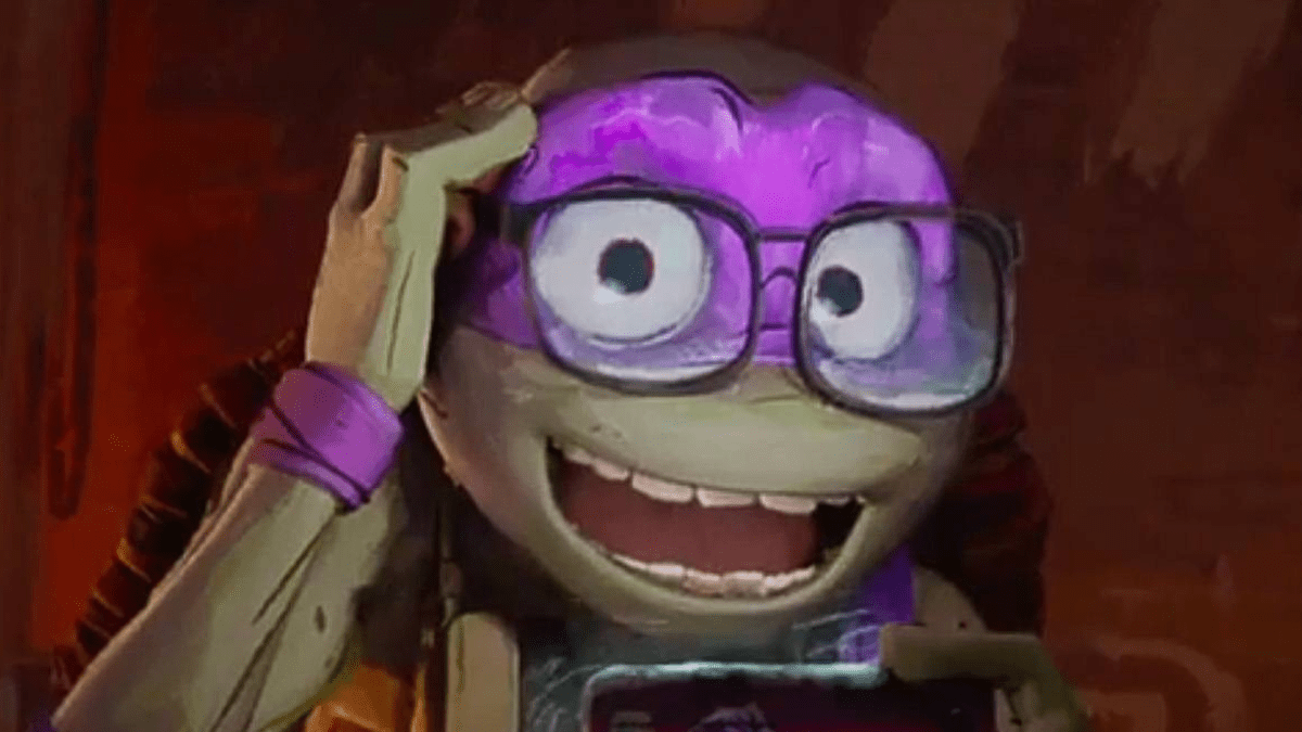 Donatello from "Teenage Mutant Ninja Turtles: Mutant Mayhem" holding a smartphone and smiling