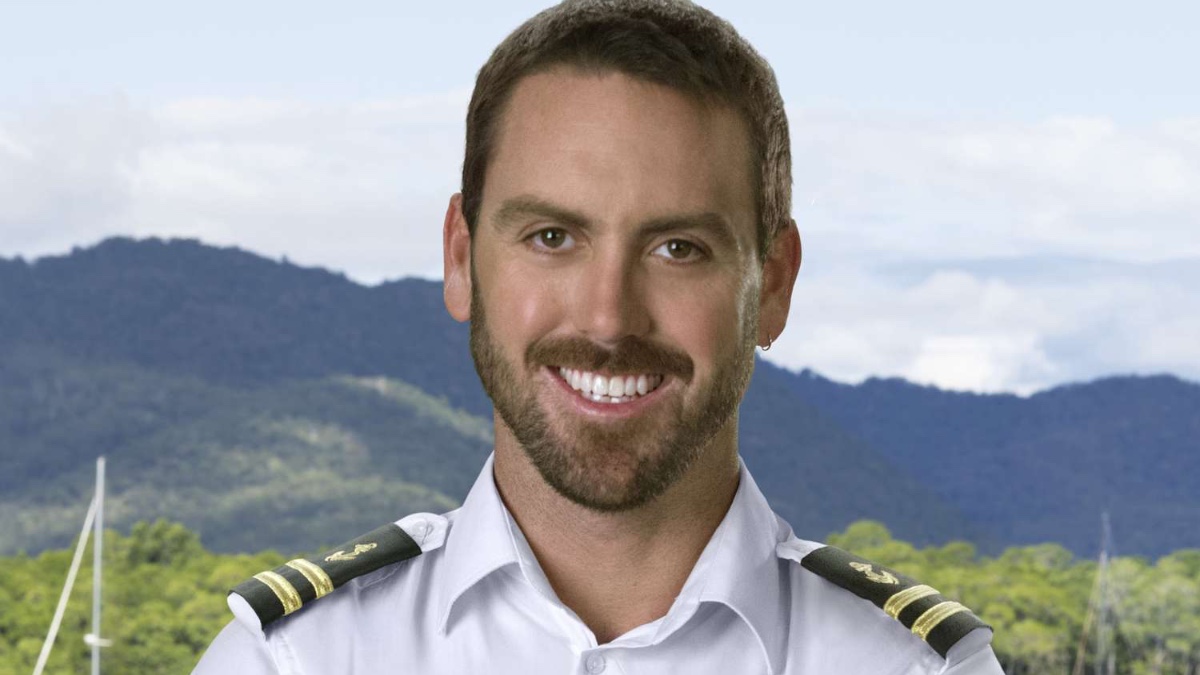 Luke Wilson smiles in uniform