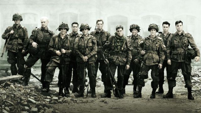 The cast of 'Band of Brothers' standing together in character, and in their army uniform.
