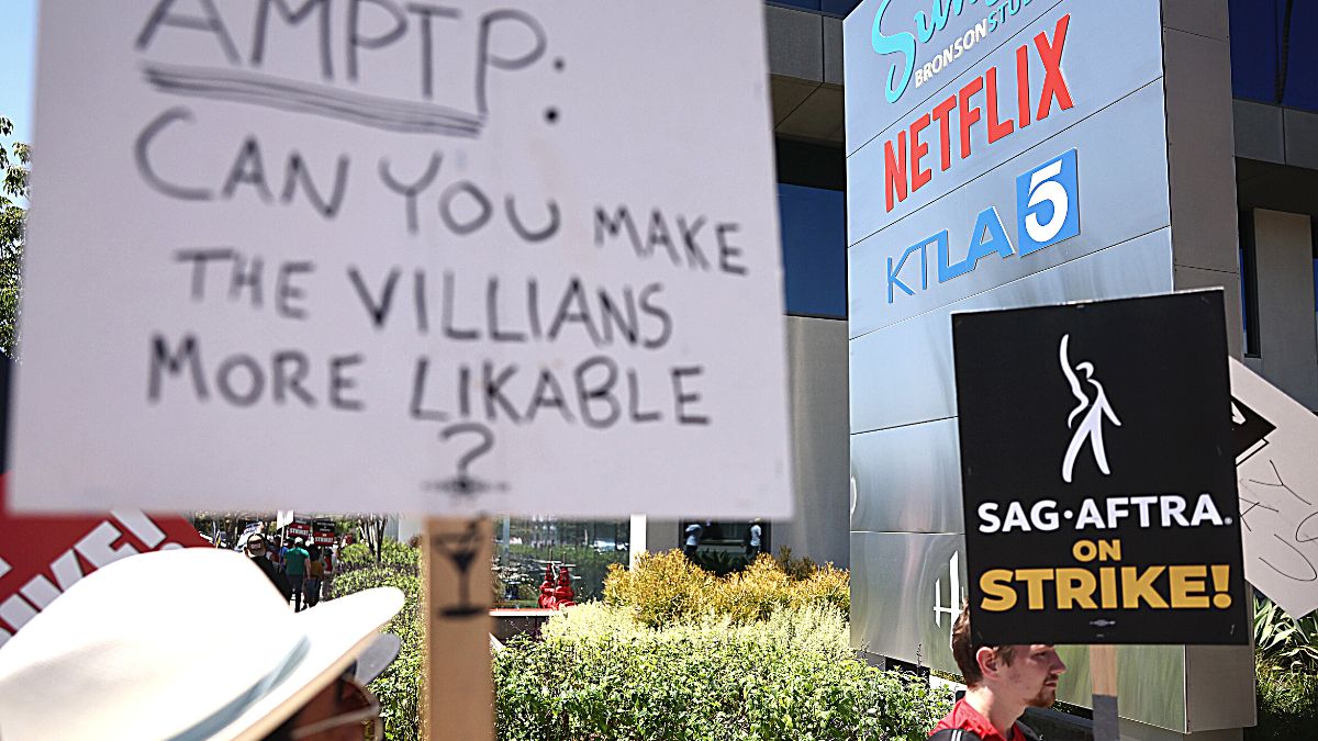 LOS ANGELES, CALIFORNIA - JULY 19: Striking SAG-AFTRA members picket with striking WGA (Writers Guild of America) workers outside Netflix offices on July 19, 2023 in Los Angeles, California. Members of SAG-AFTRA, Hollywood's largest union which represents actors and other media professionals, have joined striking WGA (Writers Guild of America) workers in the first joint walkout against the studios since 1960. The strike could shut down Hollywood productions completely with writers in the third month of their strike against the Hollywood studios. Netflix is set to report second quarter earnings after the closing bell today. 