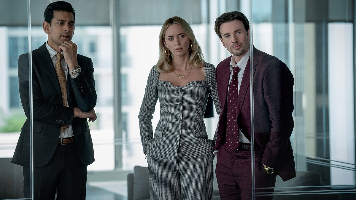 Pain Hustlers - (L to R) Amit Shah as Paley, Emily Blunt as Liza and Chris Evans as Brenner in Pain Hustlers.