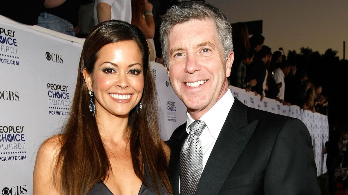 Brooke Burke and Tom Bergeron posing for a photo on the red carpet together