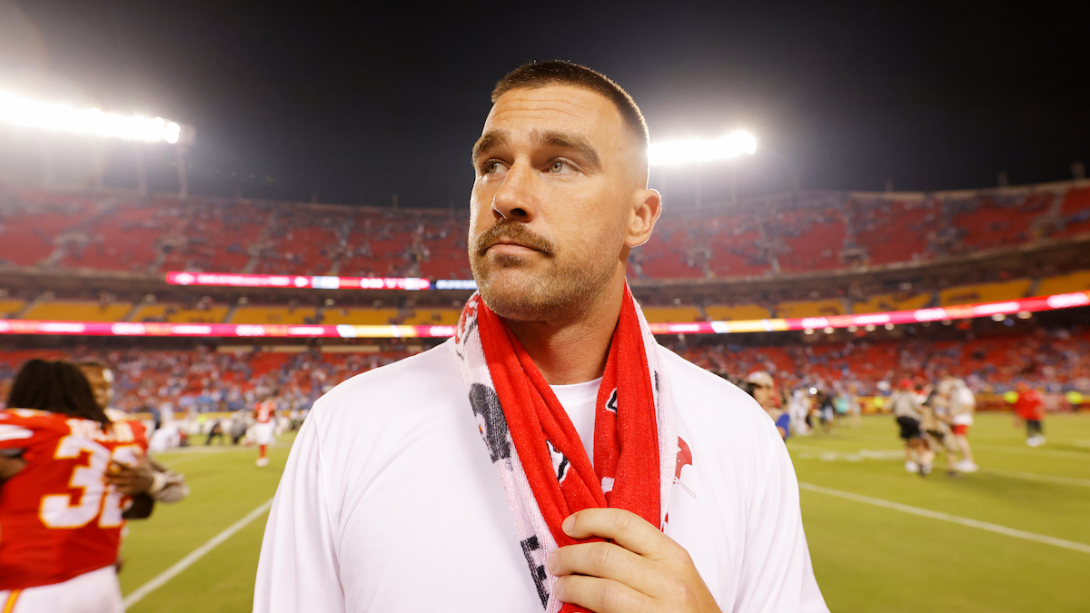 An injured Travis Kelce #87 of the Kansas City Chiefs reacts after their loss to the Detroit Lions at GEHA Field at Arrowhead Stadium