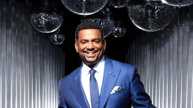 Alfonso Ribeiro smiling in a blue suit and tie in a promo for 'Dancing with the Stars'
