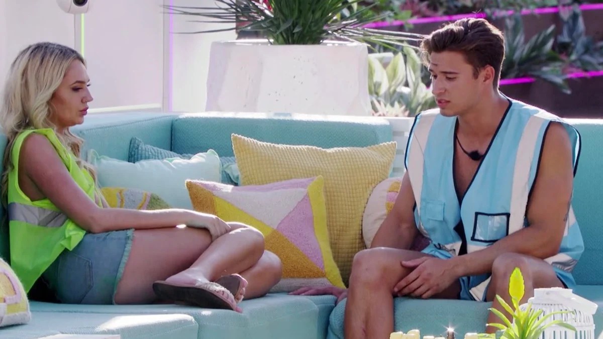 Laurel Goldman and Carrington Rodriguez on a couch having a serious conversation on 'Love Island'