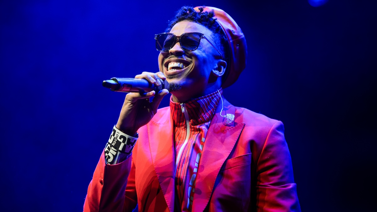 August Alsina performs live on stage in a red jacket and red hat at Indigo at The O2 Arena