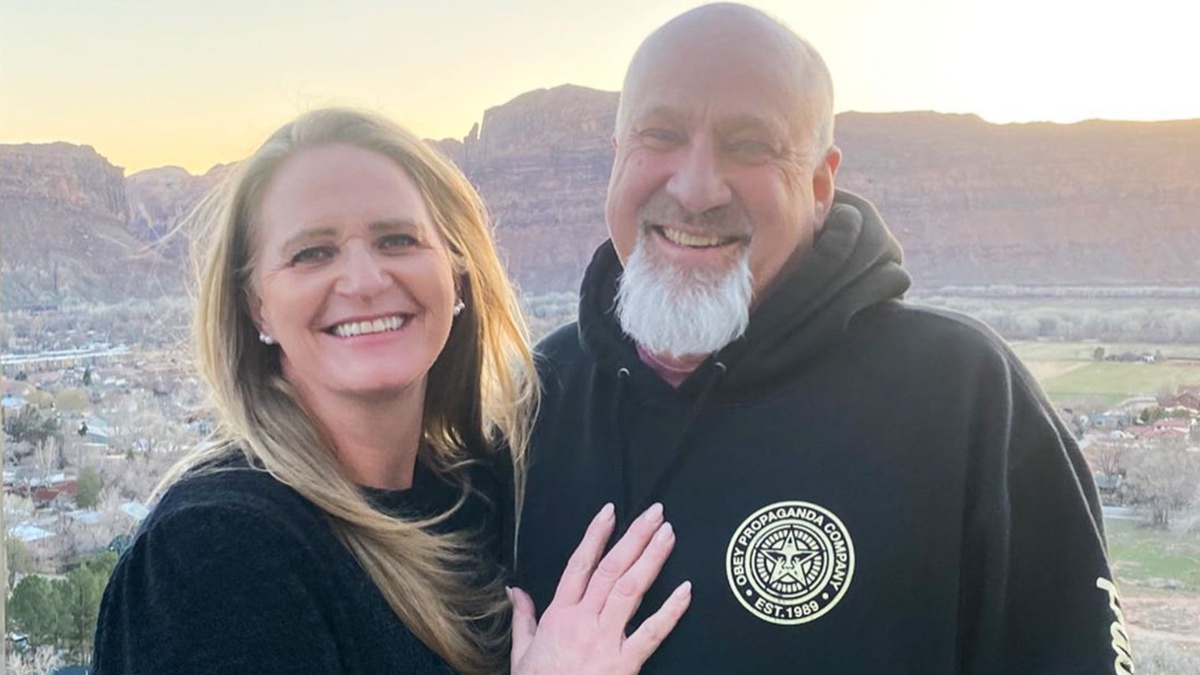 Christine Brown and David Woolley posing outdoors together