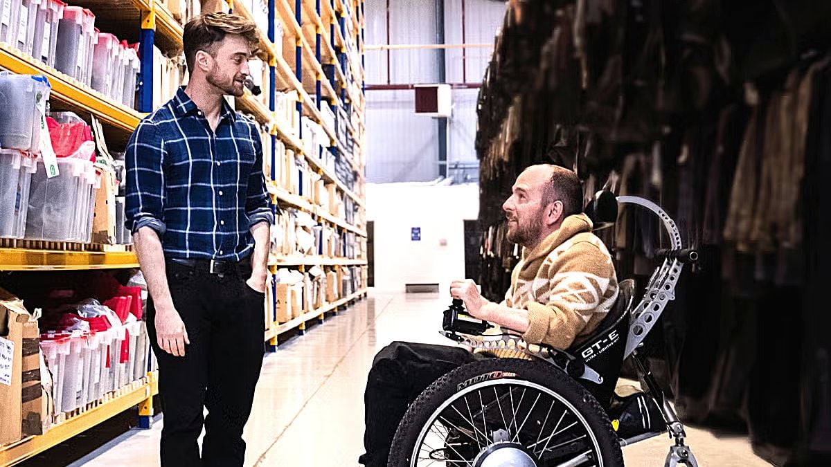 Daniel Radcliffe (L) and David Holmes (R) chat in a still from HBO's 'David Holmes: The Boy Who Lived' documentary.