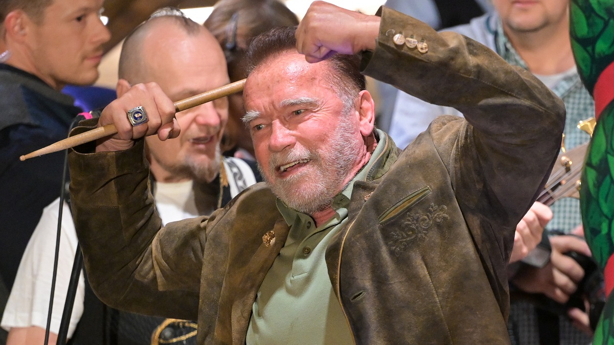 MUNICH, GERMANY - SEPTEMBER 23: Arnold Schwarzenegger conducts the band at Marstall tent during the 188th Oktoberfest on September 23, 2023 in Munich, Germany.