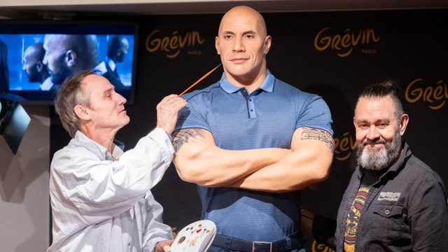 PARIS, FRANCE - OCTOBER 16: Painter Franck Bruno (L) and sculptor Stephane Barret (R) pose with Dwayne Johnson wax figure unveiled at Musee Grevin on October 16, 2023 in Paris, France.